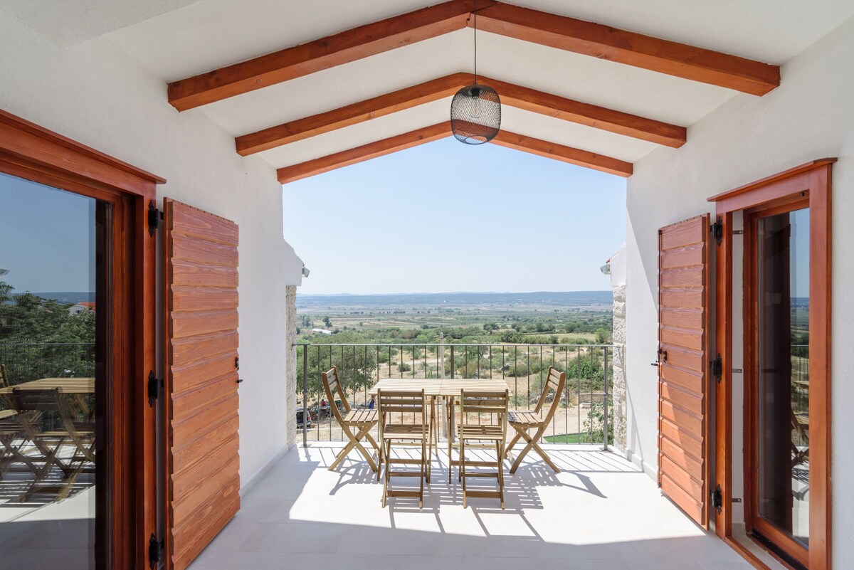 Covered balcony at Authentic Stone Villa looking over the Dalmatian landscape