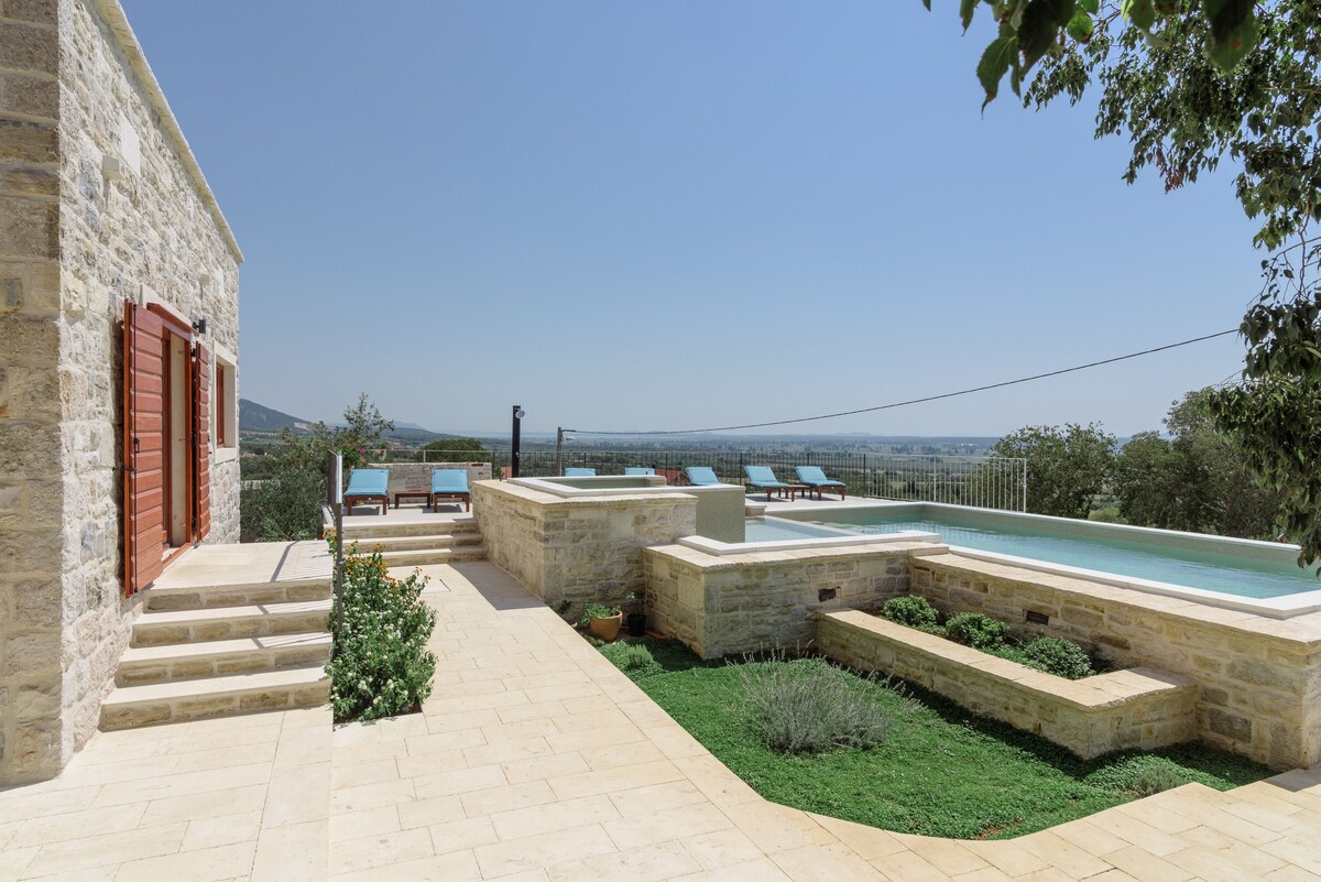 Pool terrace at Authentic Stone Villa looking across the surrounding Dalmatian landscape